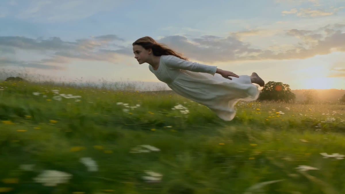Girl Flying Over Meadow Lake